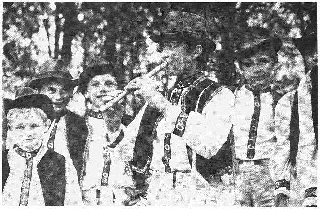 Playing Sopilka in Traditional Clothes